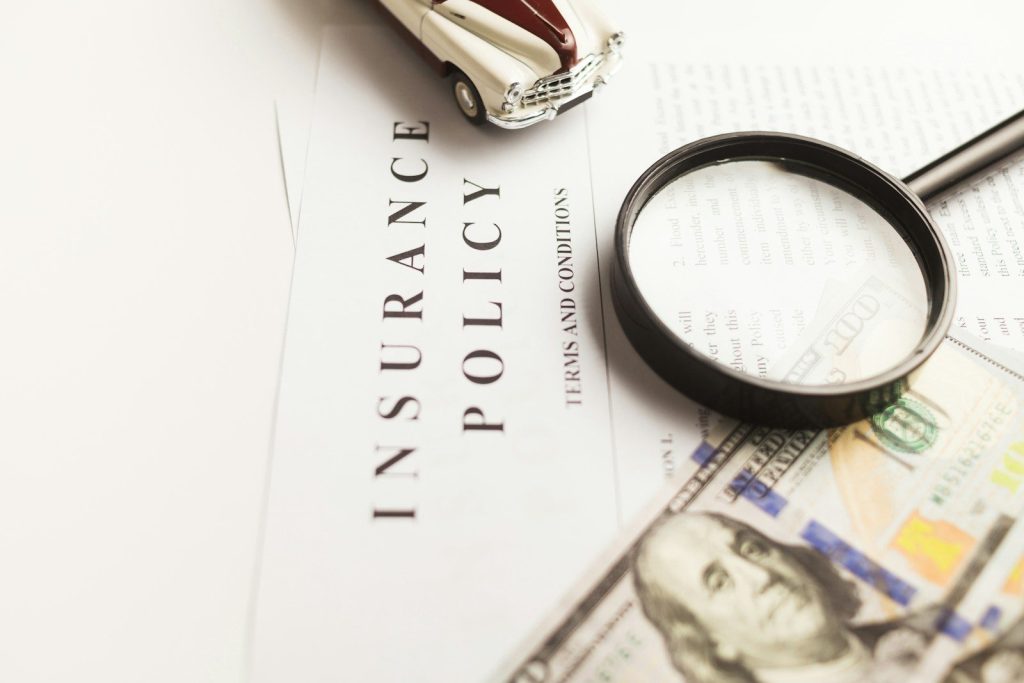 a magnifying glass sitting on top of a piece of paper — Illinois workers compensation attorney Chicago