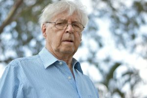 selective focus photography of man wearing blue and white striped collared top — Illinois workers compensation attorney Chicago